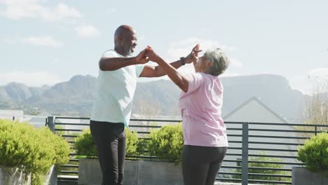 video of happy senior african american couple dancing