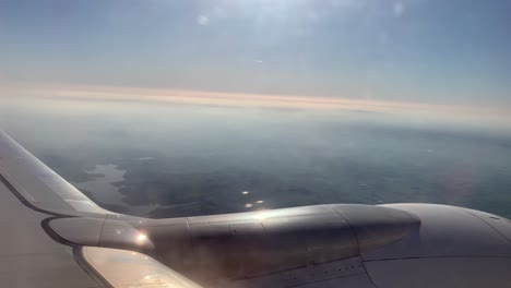 tranquil view from airplane window with engine visible during peaceful flight