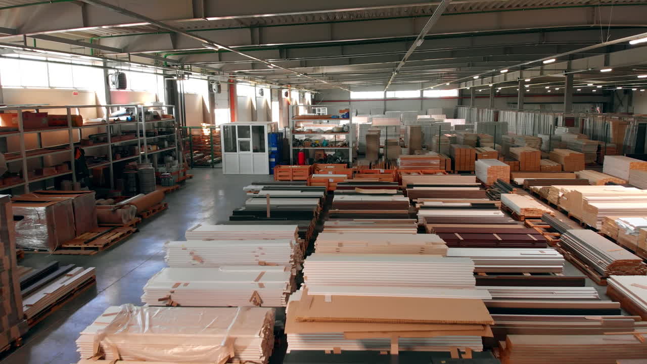 Storehouse with materials for door production of diverse colors. Huge warehouse backdrop.