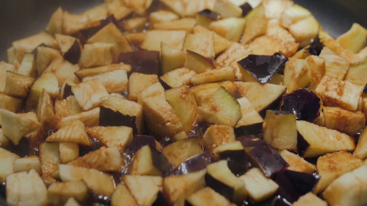 Sliced Eggplant Frying In A Pan With Wine
