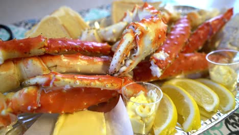 red king crab legs with fresh lemon slices. delicious seafood and luxury restaurant menu.