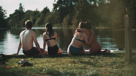 friends relaxing by the lake