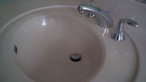 Close-up-woman's-hand-washing-hand-at-bathroom-in-the-morning