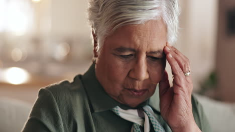 elderly woman experiencing headache