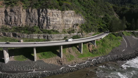 Campervan-driving-over-famous-sea-cliff-bridge-in-Australia