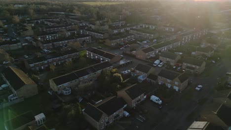 Epic-side-shot-of-a-British-town-during-sunset-with-flares