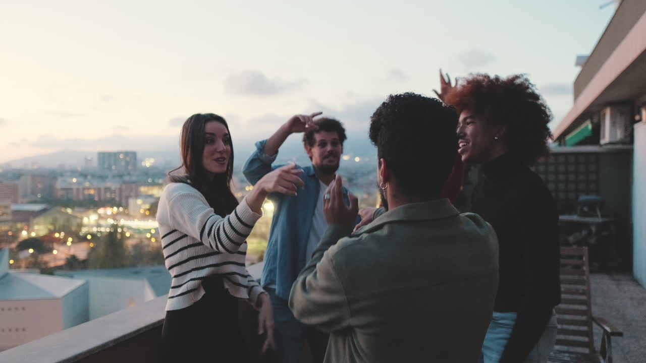 Group of friends having fun on a rooftop