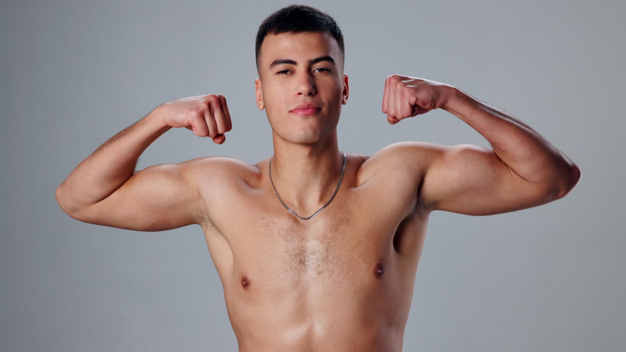 Shirtless man flexing his muscles