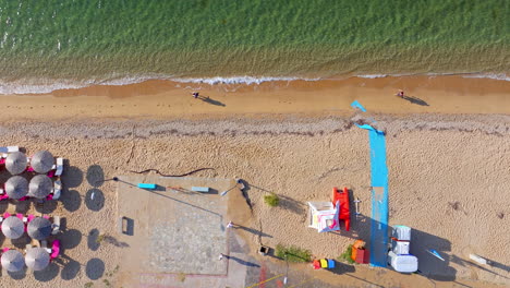 Aerial View of a Beach with Umbrellas and People