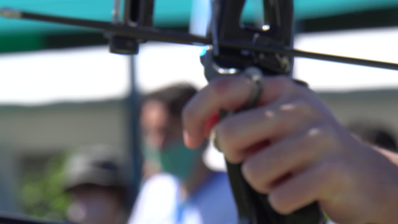 Arrow release in slow motion from the front