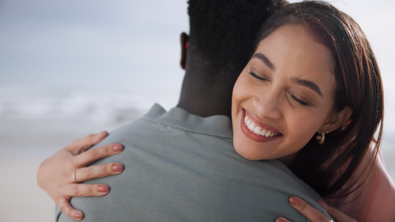 A loving couple hugging on the beach