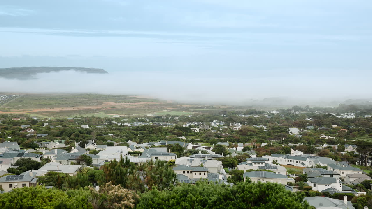 Foggy coastal town landscape