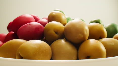 pickled round green olives from greece as background, top view. high quality 4k footage