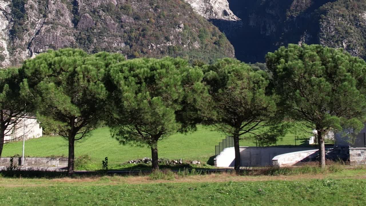Drone view capturing lush greenery and mountains in the Italian Alps