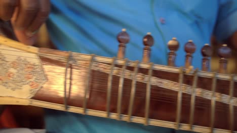 Man-Tuning-Sitar