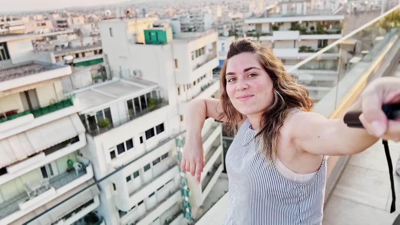 Woman Prepares to Film Athens Cityscape Vlog