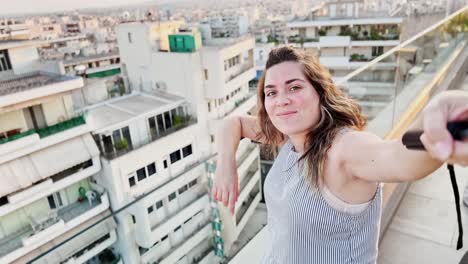 woman prepares to film athens cityscape vlog