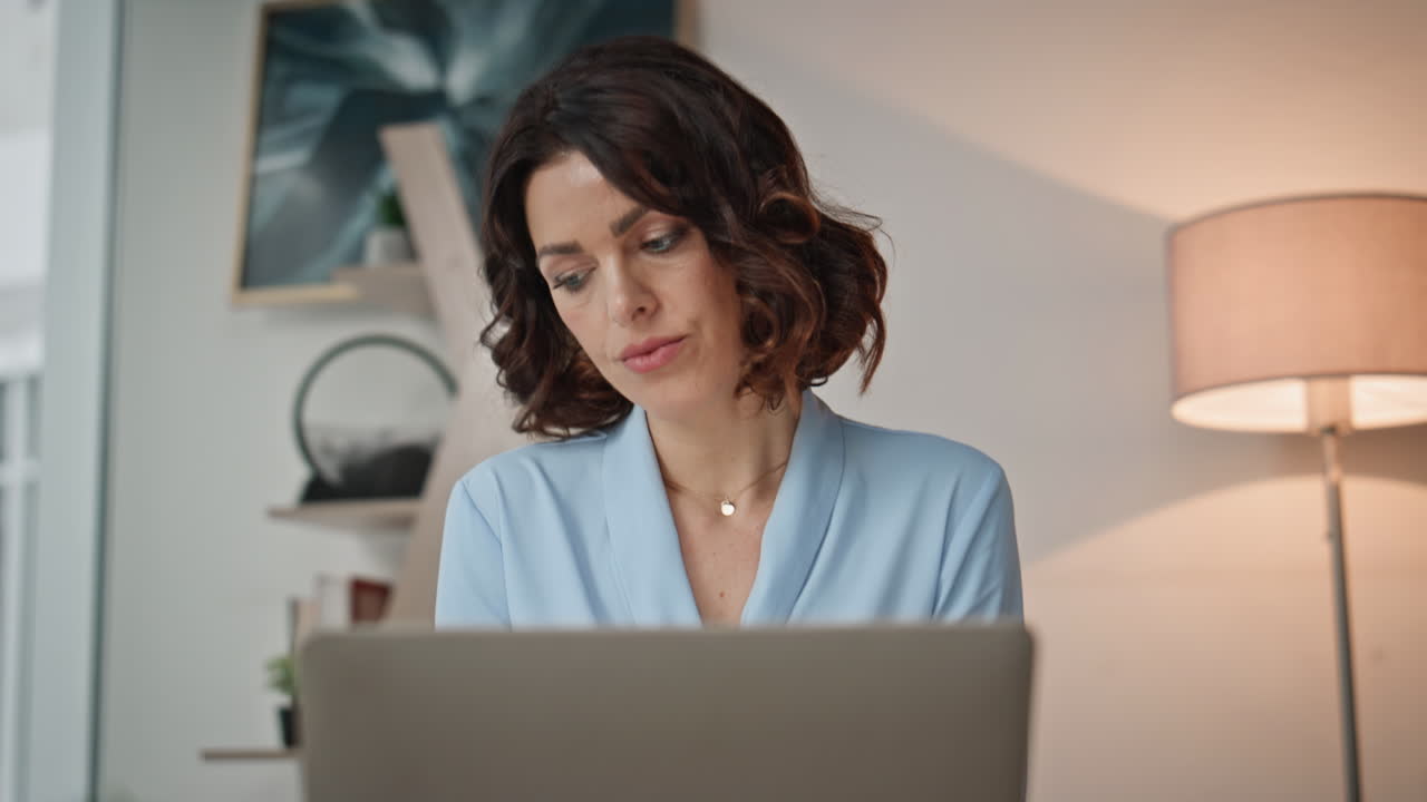 Manager developing online project at office closeup. Serious woman working