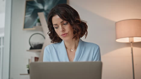 manager developing online project at office closeup. serious woman working