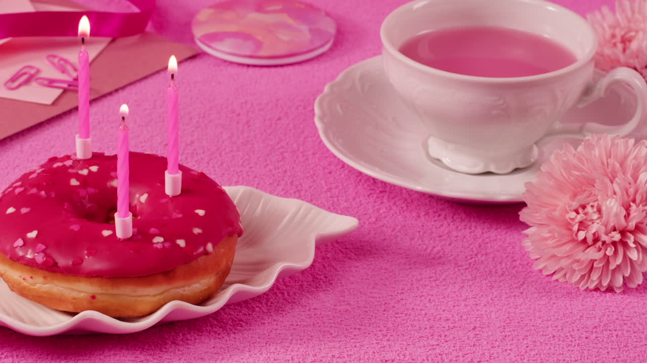 Pink Birthday Donut with Tea and Flowers