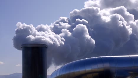 carbon emission to the atmosphere from industrial pipes, toxic fumes from factory