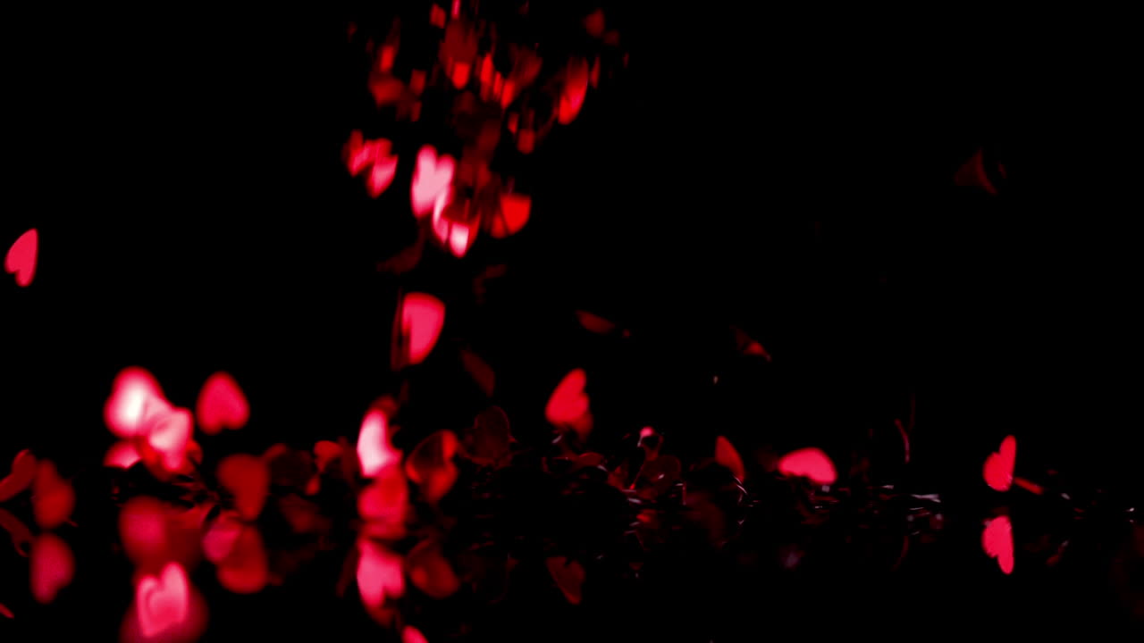 검은 바탕 위에 떨어지는  ⁇ 은 심장의 애니메이션
