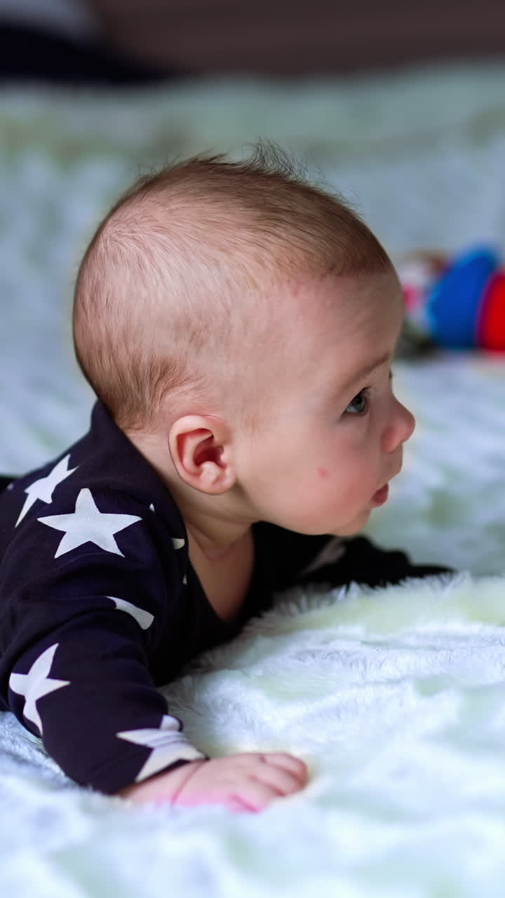 Baby Lying Prone on a Bed