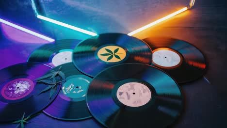 vinyl records and cannabis with neon lighting