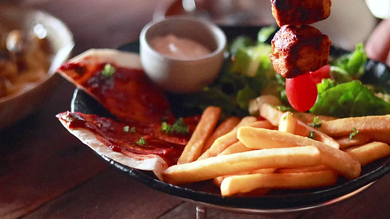Delicious grilled chicken with fries and sauce