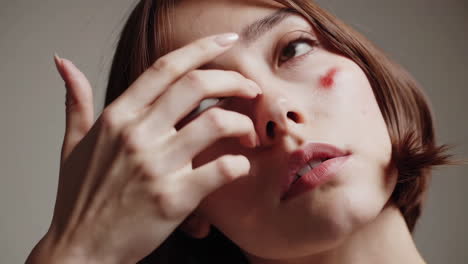 close-up portrait of a woman with unique makeup