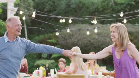 senior couple dancing outdoors