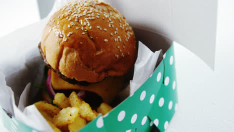 hamburger and french fries on table