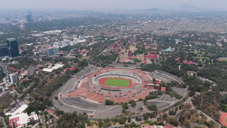 high-flying drone capture of ciudad universitaria, situated south of cdmx, on a hot day