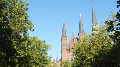 gouwekerk church against blue sky in gouda, netherlands - low angle