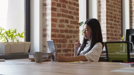 woman having a video call in a modern office.