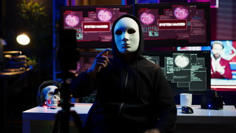 hacker doing online activism, wearing anonymous masks and filming video