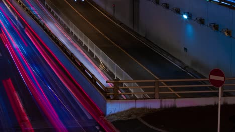 a night timelapse of the traffic jam at the city street in tokyo long shot