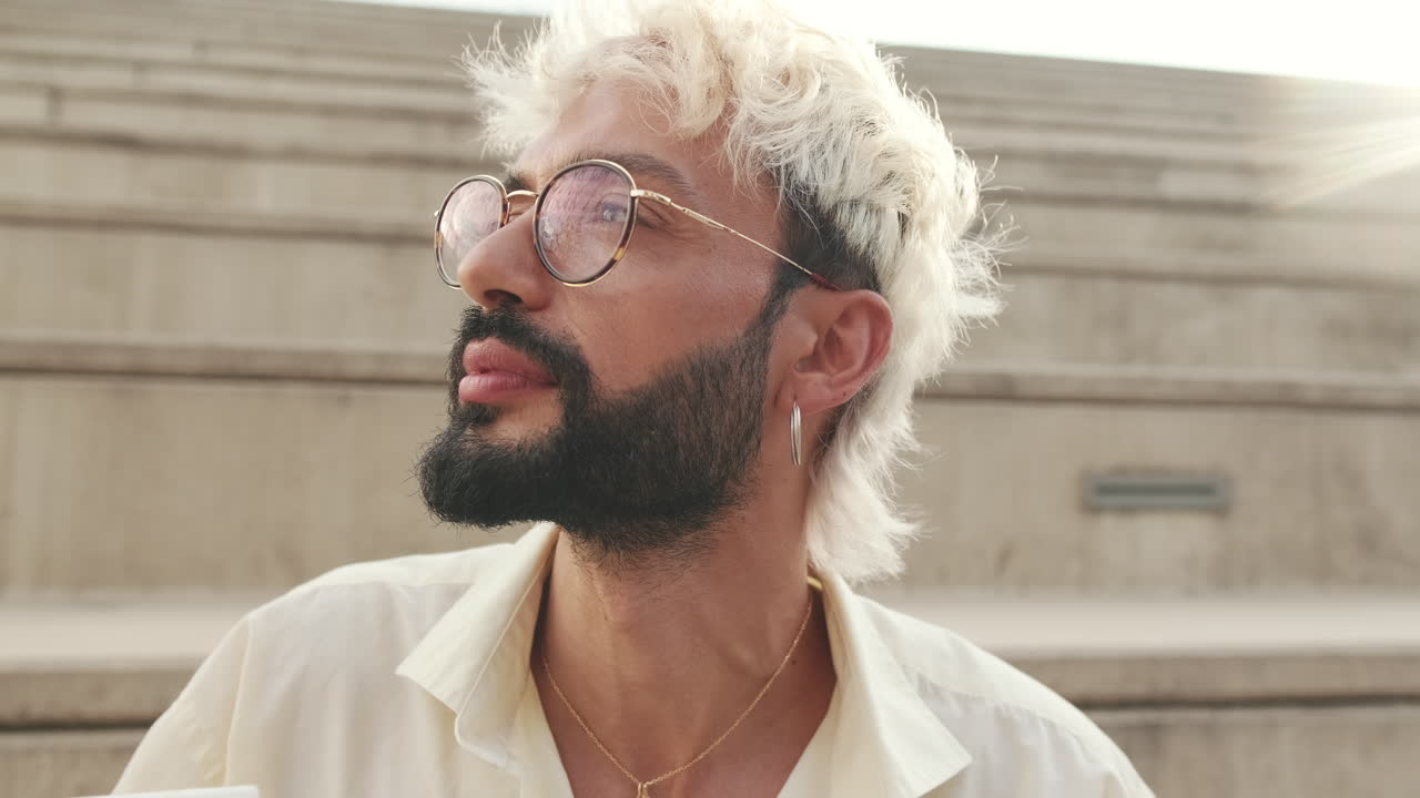 Thoughtful Man with Blonde Hair and Beard Looking Sideways