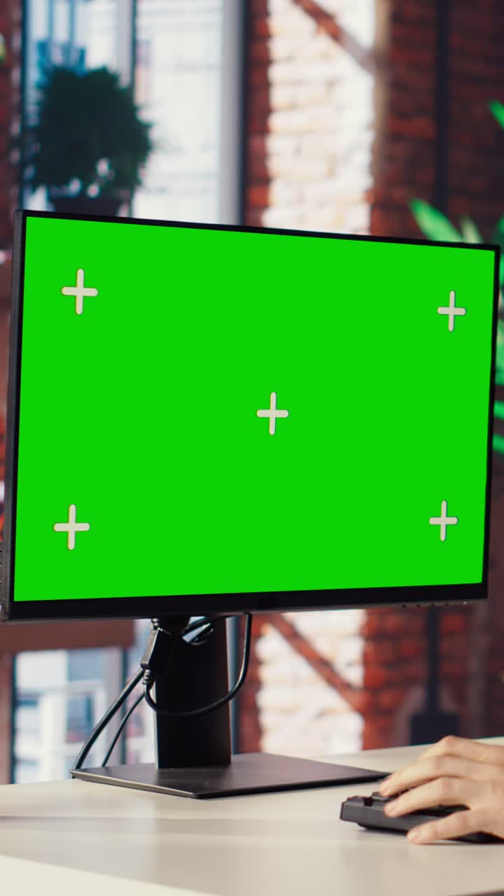 Vertical video Teleworker in living room home office using chroma key PC to answer emails