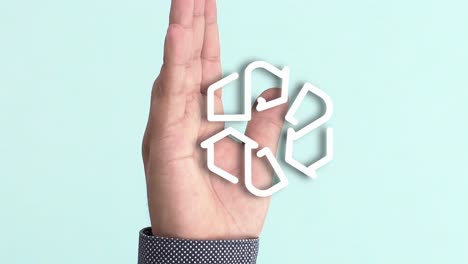 Hand-of-a-person-on-which-the-animation-of-a-recycling-symbol-appears