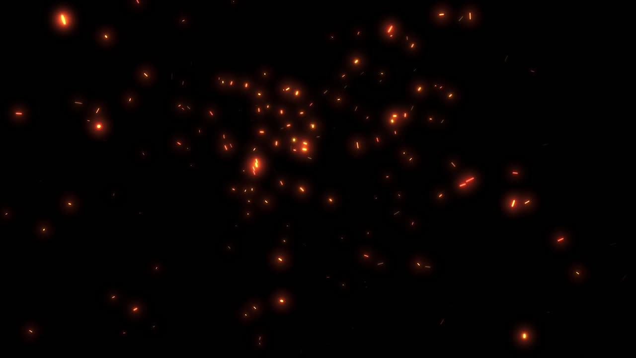 Chispas naranjas brillantes flotando sobre fondo negro