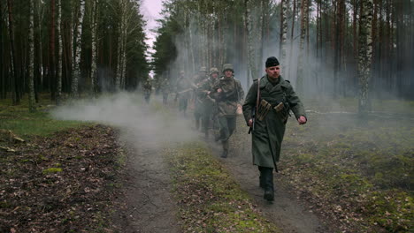 german soldiers marching through a forest