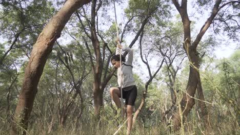 a sporty gymnast performs exercises with a rope in sportswear
