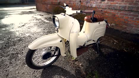 Awesome-tracking-shot-of-a-scooter-in-front-of-a-brick-wall