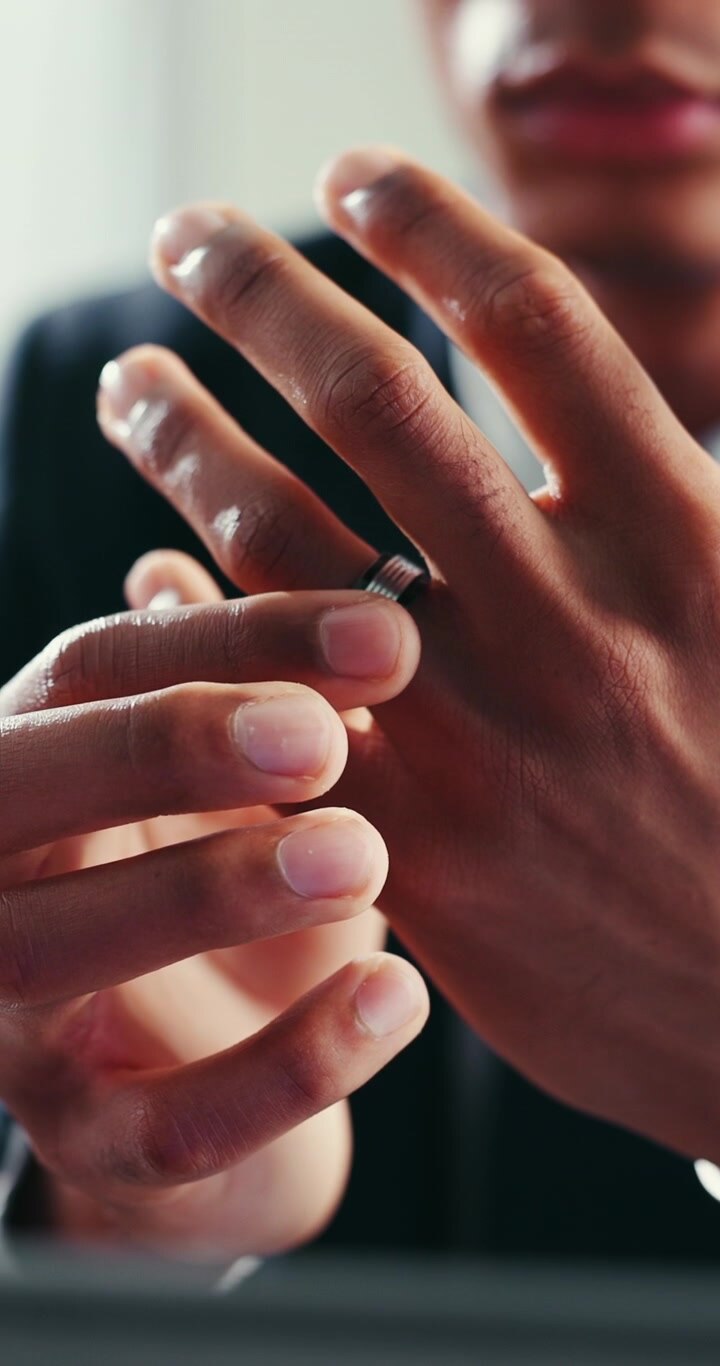 Man Adjusting His Wedding Ring on His Finger