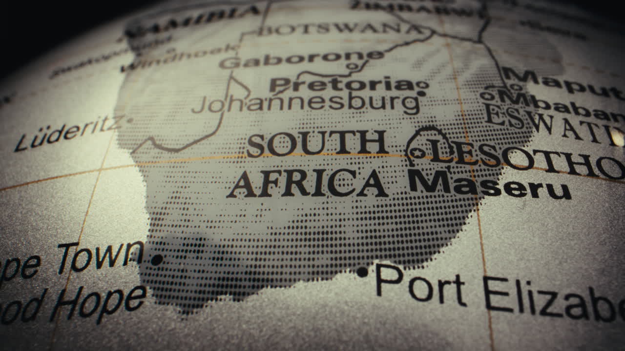 Close-up view of a world globe, focusing on the South Africa region.