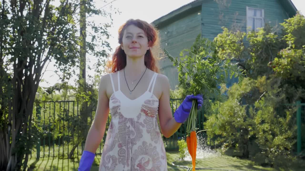 Woman Harvesting Carrots in a Garden