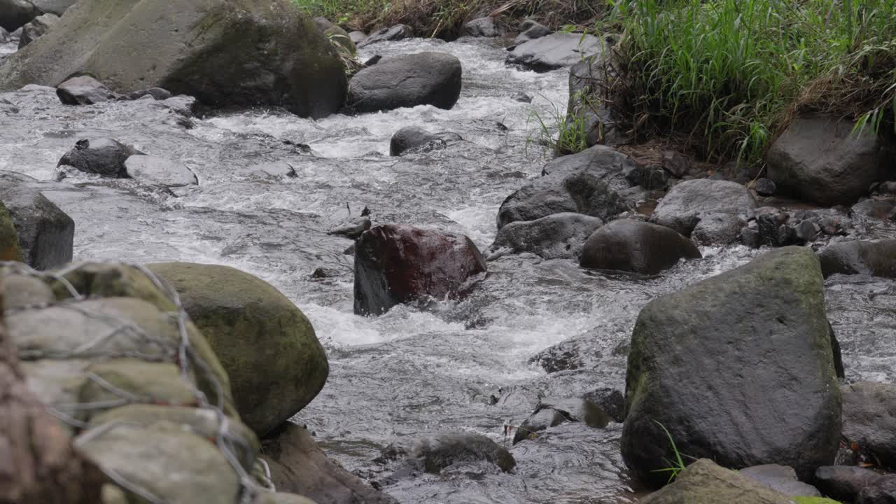 Slow-Motion Of Rocky River, Water Flow Through Rocks, Static View