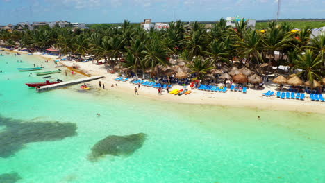 drone shot of people on the resort beach at mahahual mexico