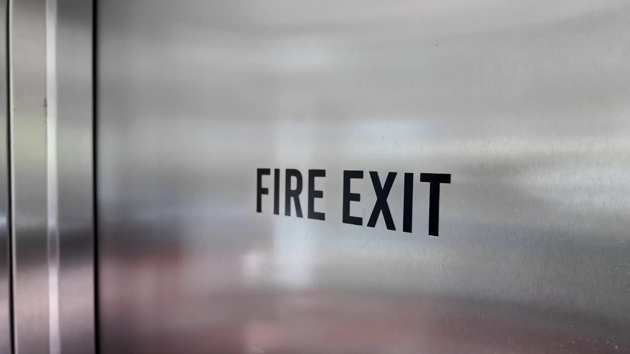 Fire Exit Sign on Metal Door